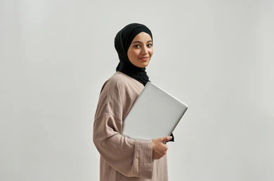 happy-young-arabian-girl-holding-260nw-1988558366